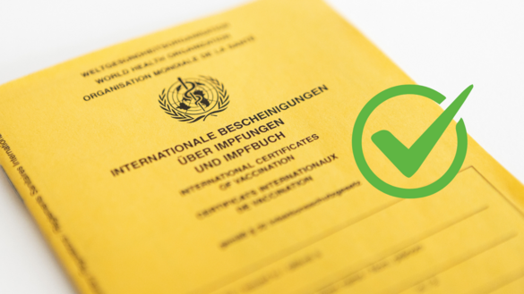 Impfbuch mit grünem Check-Haken